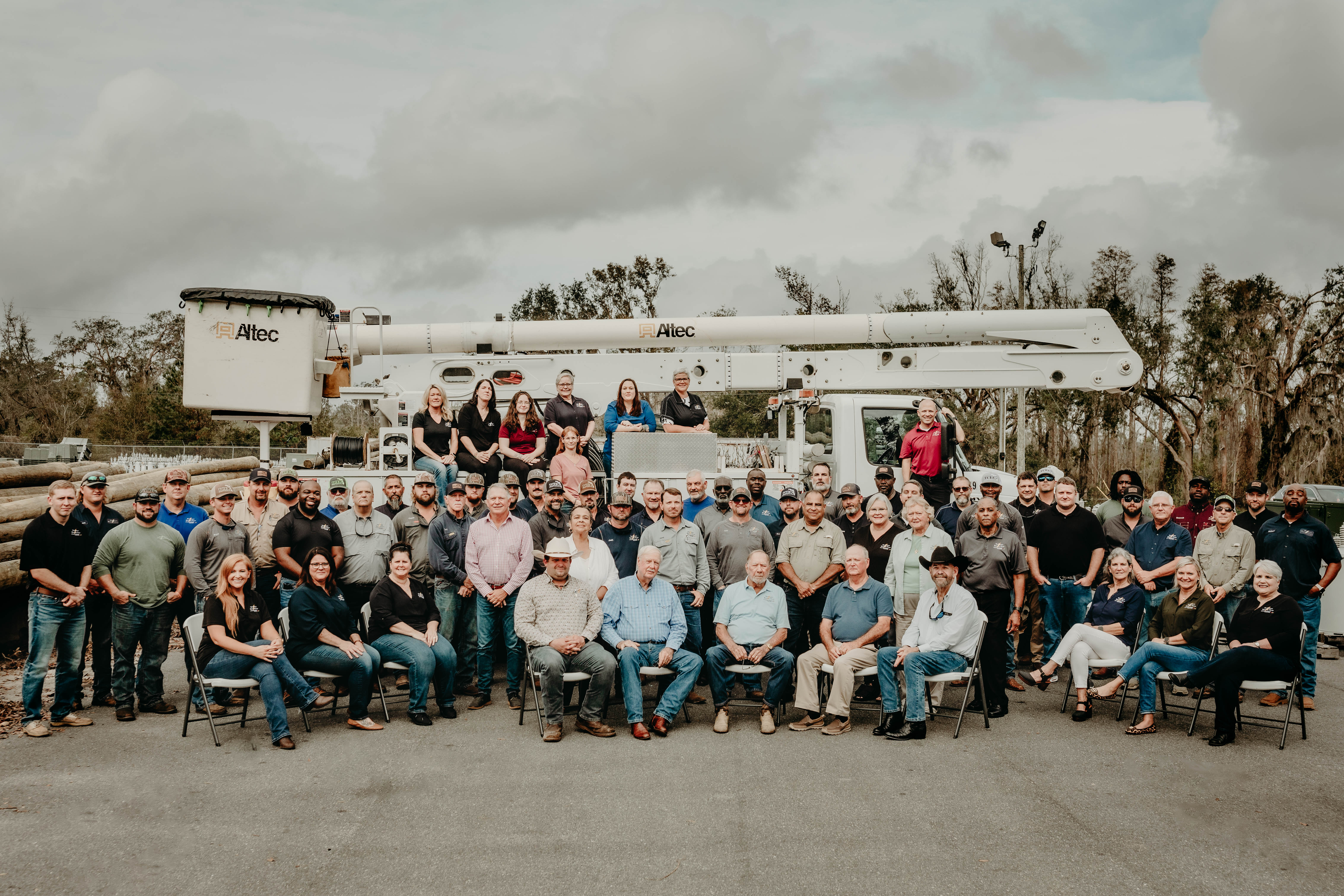 TCEC Employees in front of Bucket Truck 